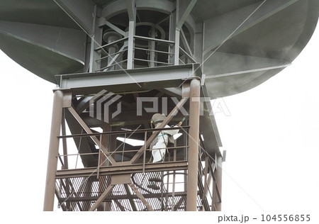 Sandblasting process. Cleaning the metal construction surface from rust before painting. Anticorrosive metal protection. Sandblasting process. Cleaning the metal construction surface from rust before painting. Anticorrosive metal protection. 104556855