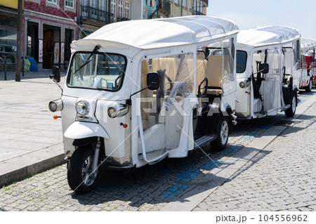 Tuk tuk moto taxi on Porto, Portugal. Electric transport for turists. Tuk tuk moto taxi on Porto, Portugal. Electric transport for turists. 104556962