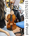 Real life young music students during rehearsals. Musical instruments and music stand with stave. 104557015