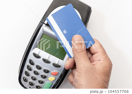 Hand make payment with credit card with NFC contactless technology on terminal device. White background Hand make payment with credit card with NFC contactless technology on terminal device. White background 104557708