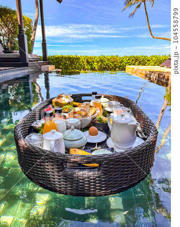 Floating breakfast in pool in Lamai beach resort in Koh Samui, Thailand Floating breakfast in pool in Lamai beach resort in Koh Samui, Thailand 104558799