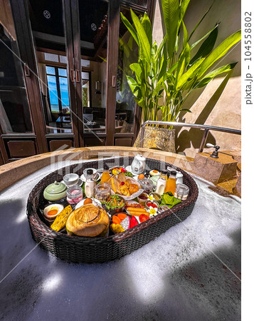 Floating breakfast in pool in Lamai beach resort in Koh Samui, Thailand Floating breakfast in pool in Lamai beach resort in Koh Samui, Thailand 104558802
