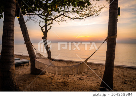 Beachfront sunrise with pool and palm trees in Hua Hin, Prachuap Khiri Khan, Thailand 104558994