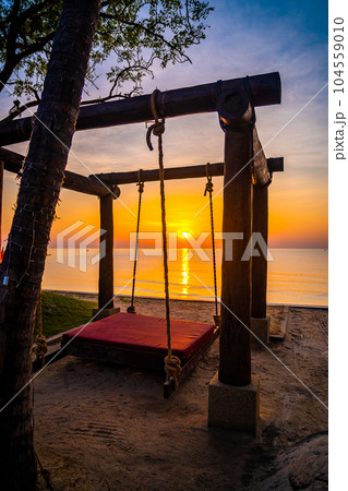 Beachfront sunrise with pool and palm trees in Hua Hin, Prachuap Khiri Khan, Thailand 104559010