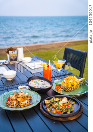 Thai food dishes in a restaurant beachfront in Hua Hin, Thailand 104559017