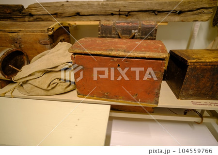 An old chest for storing dowry or food in a wooden hut. A symbol of prosperity and wealth. Estonian islands Kihnu. 104559766