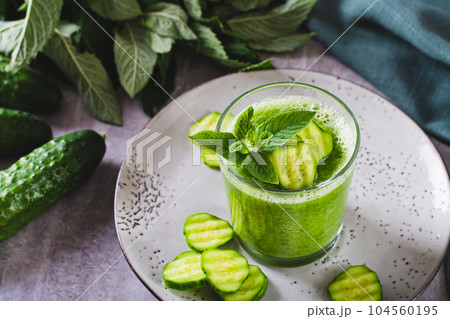 Diet cucumber and mint smoothie in a glass for breakfast 104560195