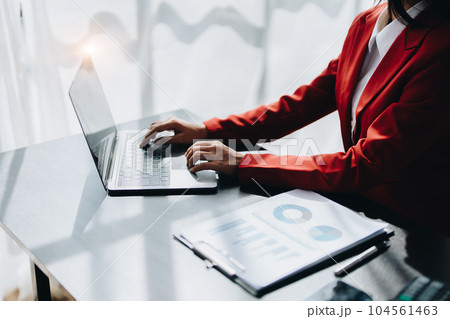 Beautiful young teen asian businesswoman using laptop computer and paperworks with planning working on financial document, tax, exchange, accounting and Financial advisor. Beautiful young teen asian businesswoman using laptop computer and paperworks with planning working on financial document, tax, exchange, accounting and Financial advisor. 104561463