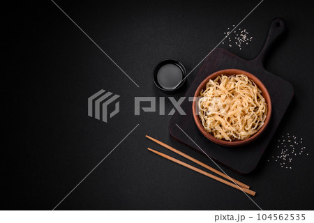 Delicious dried squid in the form of shavings with salt and spices 104562535
