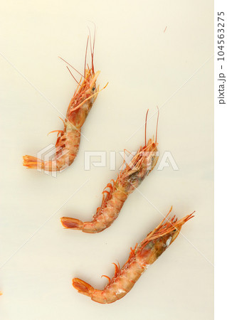 frosted king prawns closeup photo on white table background frosted king prawns closeup photo on white table background 104563275