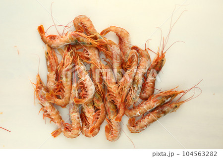 frosted king prawns closeup photo on white table background  104563282