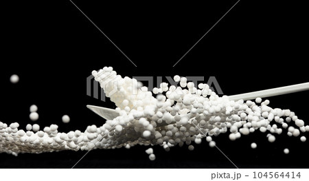 Sago seeds falling down from measure cup, white grain wave floating, Abstract fly splash in air. White Sago seeds is material food. Black background isolated selective focus blur Sago seeds falling down from measure cup, white grain wave floating, Abstract fly splash in air. White Sago seeds is material food. Black background isolated selective focus blur 104564414