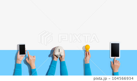 Technology devices and a piggy bank Technology devices and a piggy bank 104566934