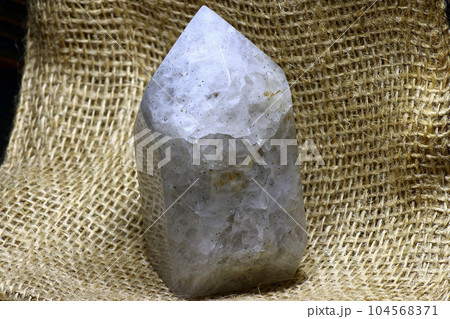 Vein icy quartz artificially processed into a crystal shape Vein icy quartz artificially processed into a crystal shape 104568371