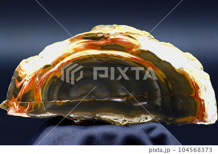 Patterned flint with colored streaks, polished cut of flint nodule 104568373