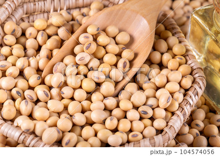 Soybean oil on a wooden background. rustic style 104574056