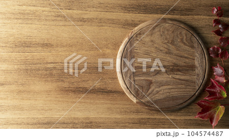 Thanksgiving background with leaves and round board 104574487