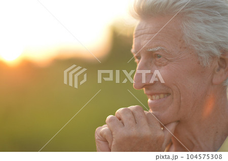 Elderly or senior man close up portrait. Happy and smiling. Elderly or senior man close up portrait. Happy and smiling. 104575308