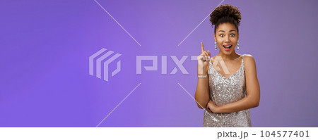 Excited charming creative african-american girl found answer raising index finger eureka gesture open mouth say suggestion widen eyes thrilled have interesting idea, blue background 104577401