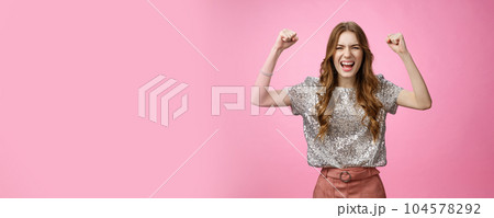 Cheerful supportive good-looking glamour woman acting daring sassy raise clenched fists yelling make bet hope team win shouting encouraging words standing hopeful wanna win see victory 104578292