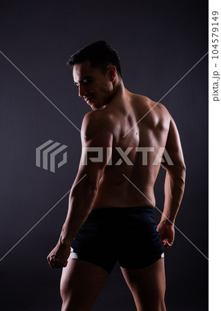 Muscular and torso of young man having abs, bicep and chest. Male hunk with athletic body. Muscular and torso of young man having abs, bicep and chest. Male hunk with athletic body. 104579149