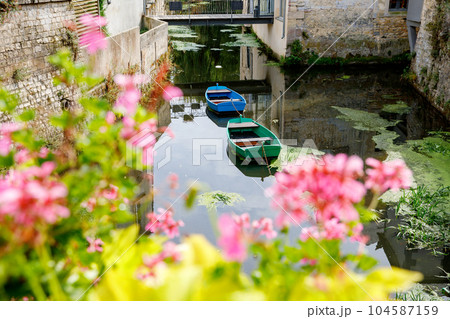 The water mill on the River Aure in the medieval town of Bayeux on the Normandy Coast of France. The water mill on the River Aure in the medieval town of Bayeux on the Normandy Coast of France. 104587159
