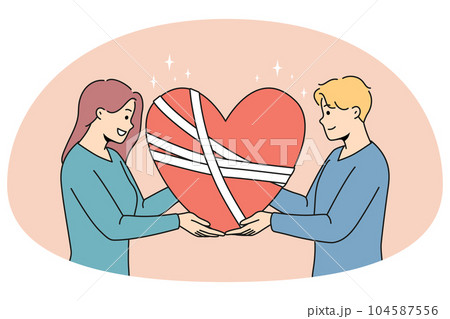 Happy man and woman hold in hands fixed broken heart 104587556