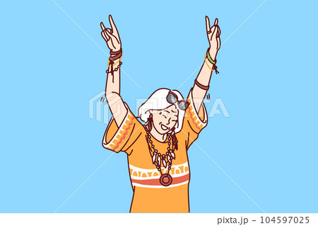 Mature hippie woman in fashionable clothes and accessories enjoys life dancing at parties 104597025