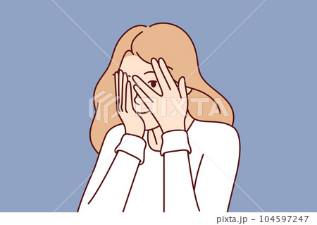 Woman covers eyes with hands and peeps, refusing to see unpleasant things and hiding from problems 104597247