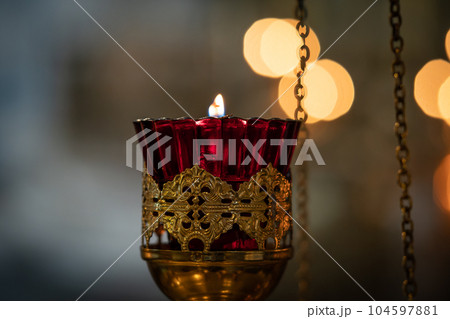 Burning candles in a Christian Orthodox church. Burning candles in a Christian Orthodox church. 104597881