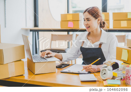 Small business owners online are taking orders and products that their customers have ordered. and check the orders that the customers have ordered of online retailers - online shopping Small business owners online are taking orders and products that their customers have ordered. and check the orders that the customers have ordered of online retailers - online shopping 104602098