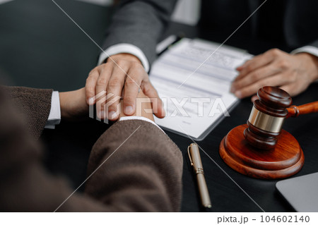 Legal advisers encourage clients. Justice and lawyer concept in the office. Legal advisers encourage clients. Justice and lawyer concept in the office. 104602140