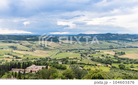 Scenic and picturesque view of Tuscany countryside rolling hills and farmland from above ancient city of Montepulciano Scenic and picturesque view of Tuscany countryside rolling hills and farmland from above ancient city of Montepulciano 104603876