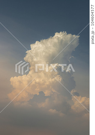 Dramatic cloud formation with interesting light and shadow against indigo blue sky as background. Dramatic cloud formation with interesting light and shadow against indigo blue sky as background. 104604577