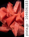 Red fresh watermelon slices, triangular fresh fruit snack on black backround, vertical summer textured image. 104606183