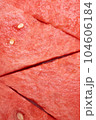 Fresh watermelon triangular slices as background or texture for summer fruits, vertical image. 104606184