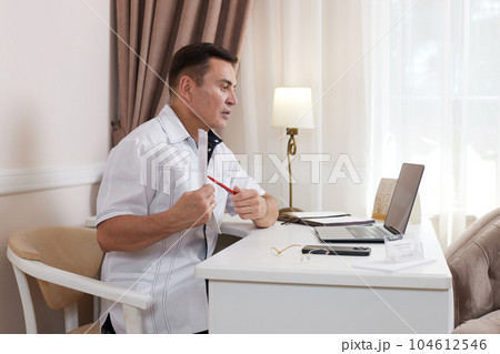 male doctor in white medical uniform using computer laptop 104612546