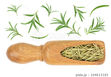 Dried rosemary or rosemarin leaves in wooden spoon isolated on white background top view Dried rosemary or rosemarin leaves in wooden spoon isolated on white background top view 104613185