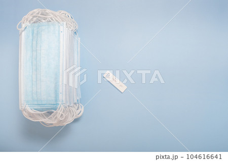 Test samples for coronavirus testing or analyzing, sterile medical mask on white background Test samples for coronavirus testing or analyzing, sterile medical mask on white background 104616641