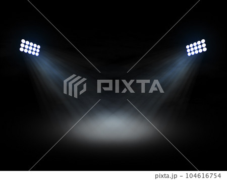 Stadium theater floolights spotlights with light beams on black background 104616754