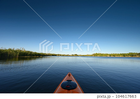 Orange kayak on Nine Mile Pond in Everglades National Park, Florida. 104617663