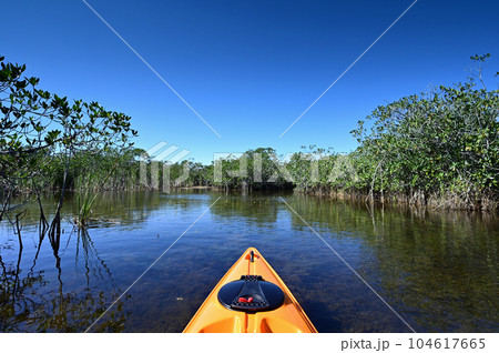 Orange kayak on Nine Mile Pond in Everglades National Park, Florida. Orange kayak on Nine Mile Pond in Everglades National Park, Florida. 104617665