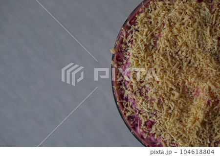 Herring under fur coat - traditional Russian layered salad with salted herring an vegetables 104618804