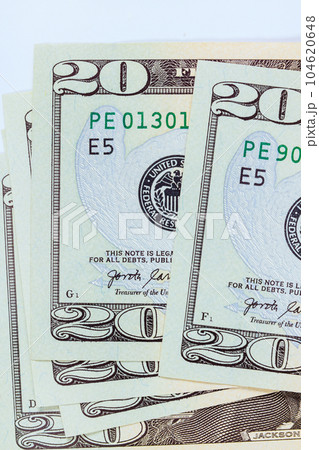 Showcases front side twenty dollar bill, featuring United States of America Banknotes with its distinctive design. Showcases front side twenty dollar bill, featuring United States of America Banknotes with its distinctive design. 104620648