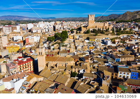 Spanish city of Villena overlooking fortified Atalaya castle Spanish city of Villena overlooking fortified Atalaya castle 104633069