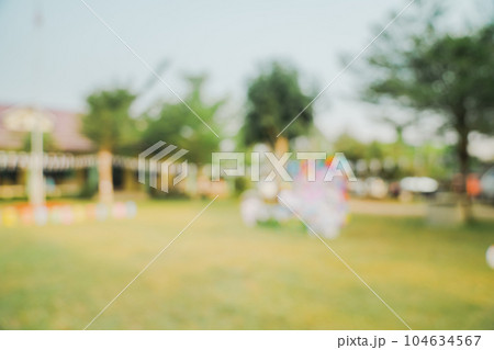Defocused bokeh and blur background of garden trees in sunlight with vintage toned. Defocused bokeh and blur background of garden trees in sunlight with vintage toned. 104634567