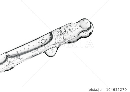 Transparent pipette with cosmetics on a white isolated background. 104635270