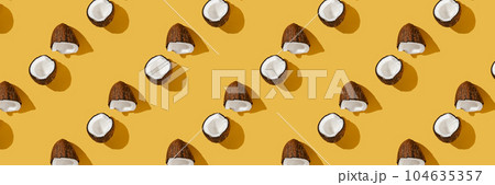 A pattern of coconuts on a bright yellow background. A pattern of coconuts on a bright yellow background. 104635357