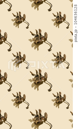 Dried leaves on a beige background. Autumn background. 104636128