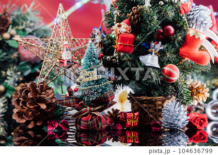 Christmas background with decorations and gift boxes on wooden Christmas background with decorations and gift boxes on wooden 104636799